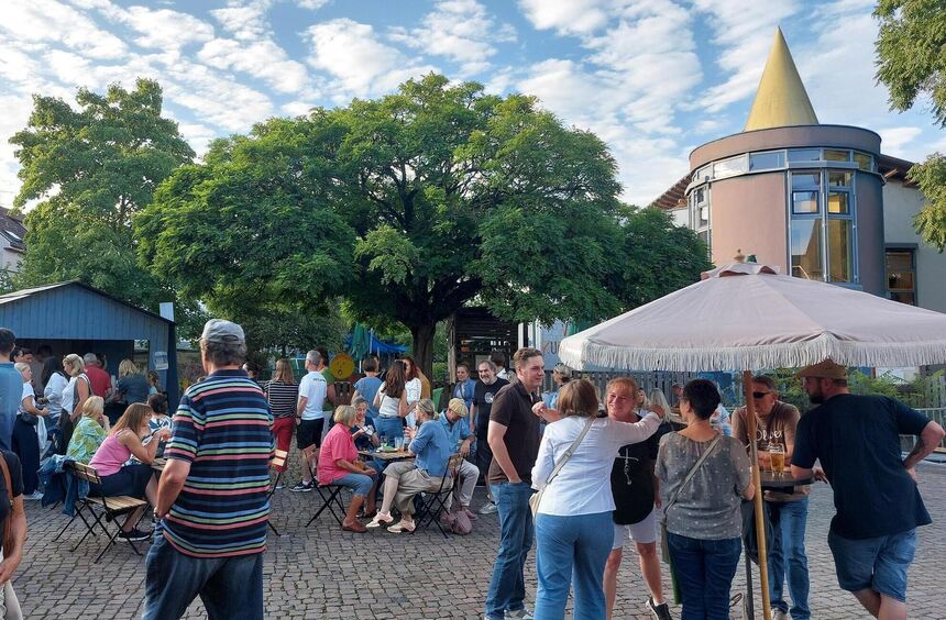 Enjoying, chatting, and toasting at Lorsch's Benedictine Square
